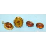 A 14ct gold ring set amber, size Q, 3.8g, a 9ct-gold-mounted amber pendant and a pair of silver-