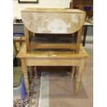 A pine table, the rectangular top above an end drawer, on turned legs, 50 x 94cm, a small drop-