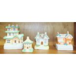 A collection of four 19th century Staffordshire cottage money boxes, tallest 17cm.