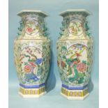 A large pair of famille rose vases of hexagonal form, decorated with panels of phoenix in