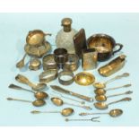 A collection of Chinese white metal, including napkin rings, a cigarette case, a drinking cup,