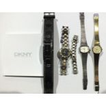 A lady's DKNY wrist watch with papers, a Fendi wrist watch and two other wrist watches, (4).