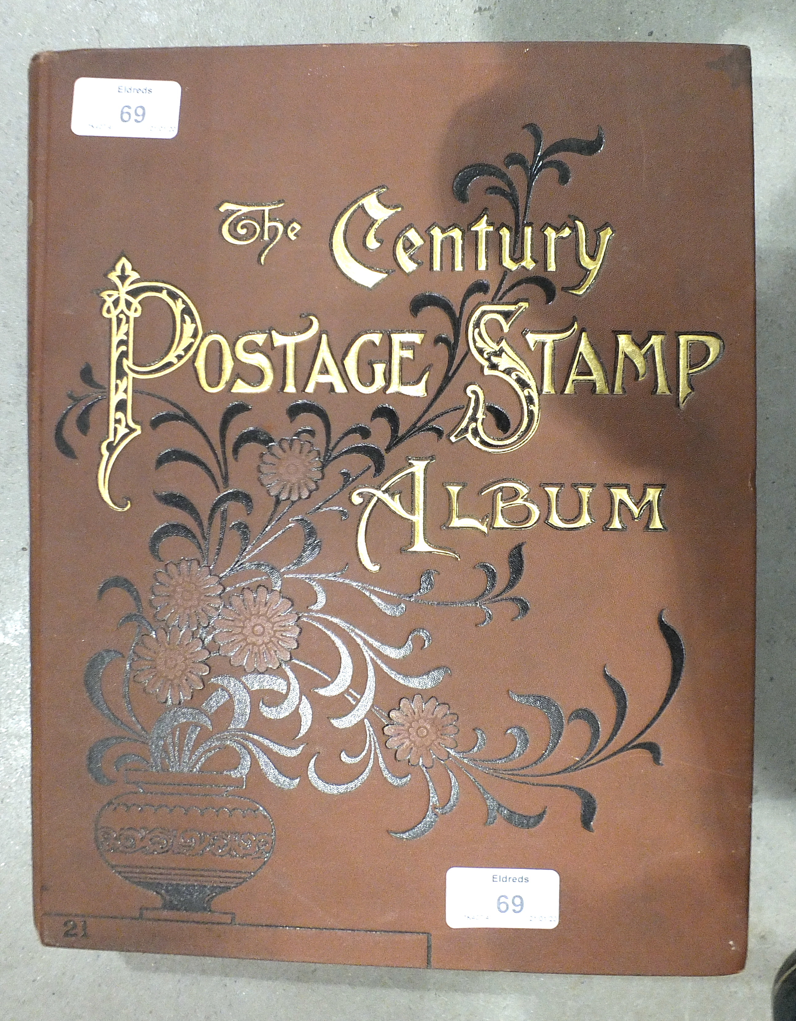 A collection of postage stamps in a Century album.