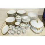 Eighty-seven pieces of Limoges dinner and coffee ware, of plain white ground with gilt-decorated
