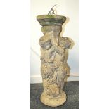 A reconstituted stone fountain in the form of two putti, converted as a sun dial, 73cm high.