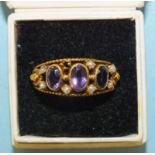 An amethyst and demi-pearl ring, in yellow metal mount, bearing Portuguese hallmarks for 800