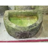 A small half-round granite trough, 58 x 42cm, 22cm high.