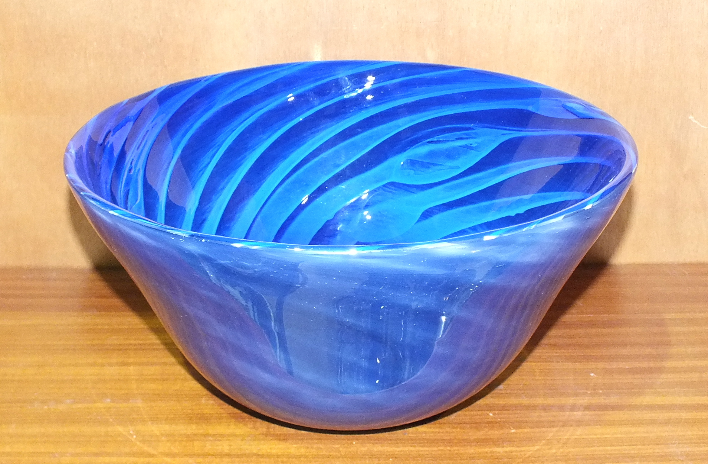 A 21st century studio blue glass bowl, the interior with ribbed decoration, 13cm high, 26.8cm