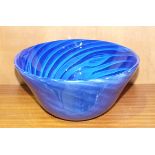 A 21st century studio blue glass bowl, the interior with ribbed decoration, 13cm high, 26.8cm