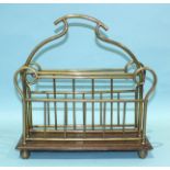 An Edwardian brass-mounted oak magazine rack, 38cm wide, 39cm high.