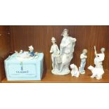 A Lladro figure group of a pregonero reading a scroll, with a young drummer boy beside, (