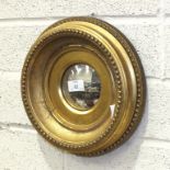 A 19th century small circular gilt frame convex mirror, mirror 10cm diameter, 27cm overall and two