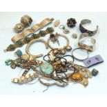 A Mexican bracelet set green hardstone masks, marked 'Sterling' and other foreign jewellery.