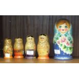 A Russian painted seven-piece babushka doll and four others, (part-sets), (5).