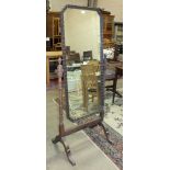 A Waring & Gillow Edwardian oak cheval mirror on turned supports, 158cm high, 70cm wide, labelled
