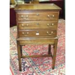 A Statton Furniture Americana cherry wood canteen cabinet, the rectangular top above three fitted