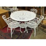 A cast metal circular-top garden table, 110cm diameter and four matching armchairs.