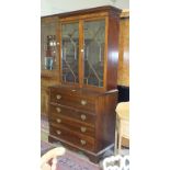 A mahogany secretaire bookcase, the dentil cornice above a pair of astragal-glazed doors, the
