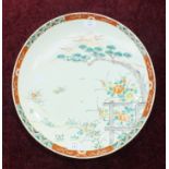 A late-19th/early-20th century Japanese Arita shallow dish decorated with flowers and Mount Fuji,