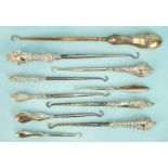 Ten various silver-handled button hooks, (10).