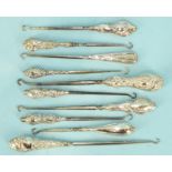 Ten various silver-handled button hooks, (10).