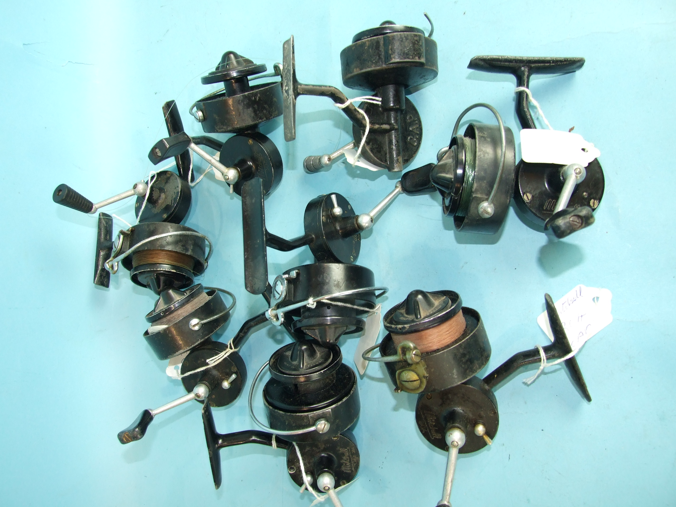 A collection of seven Mitchell CAP fixed-spool spinning reels, models 302, 304, 305, a Mitchell