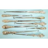 Nine various silver-handled button hooks, (9).