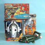 A Cyberman Voice Changer, boxed, a Chad Valley Disneyland Give-a-Show Projector, boxed, a Carlton