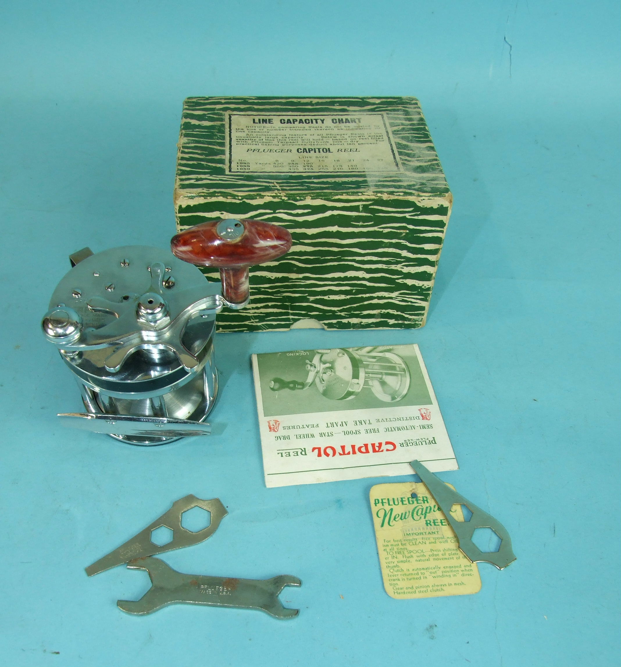 A Pflueger Capitol No.1985 Surf casting reel with spanners and instructions, boxed. - Image 2 of 2