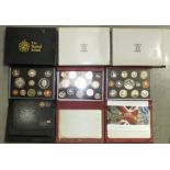 Three Royal Mint proof coin collection sets: for 2006 in red leather case, 2007 de luxe red