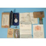 A WWII Defence Medal and an ERII Civil Defence Long Service Medal, boxed with papers, awarded to