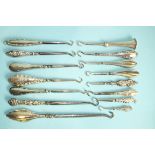 A collection of fourteen miniature silver-handled button hooks, (14).
