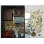 A collection of British and foreign coinage, including a quantity of pre-1947 silver, together