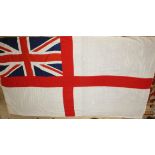 A large Royal Navy white ensign flag, 180 x 365cm, three naval books including Mark Higgit's Through