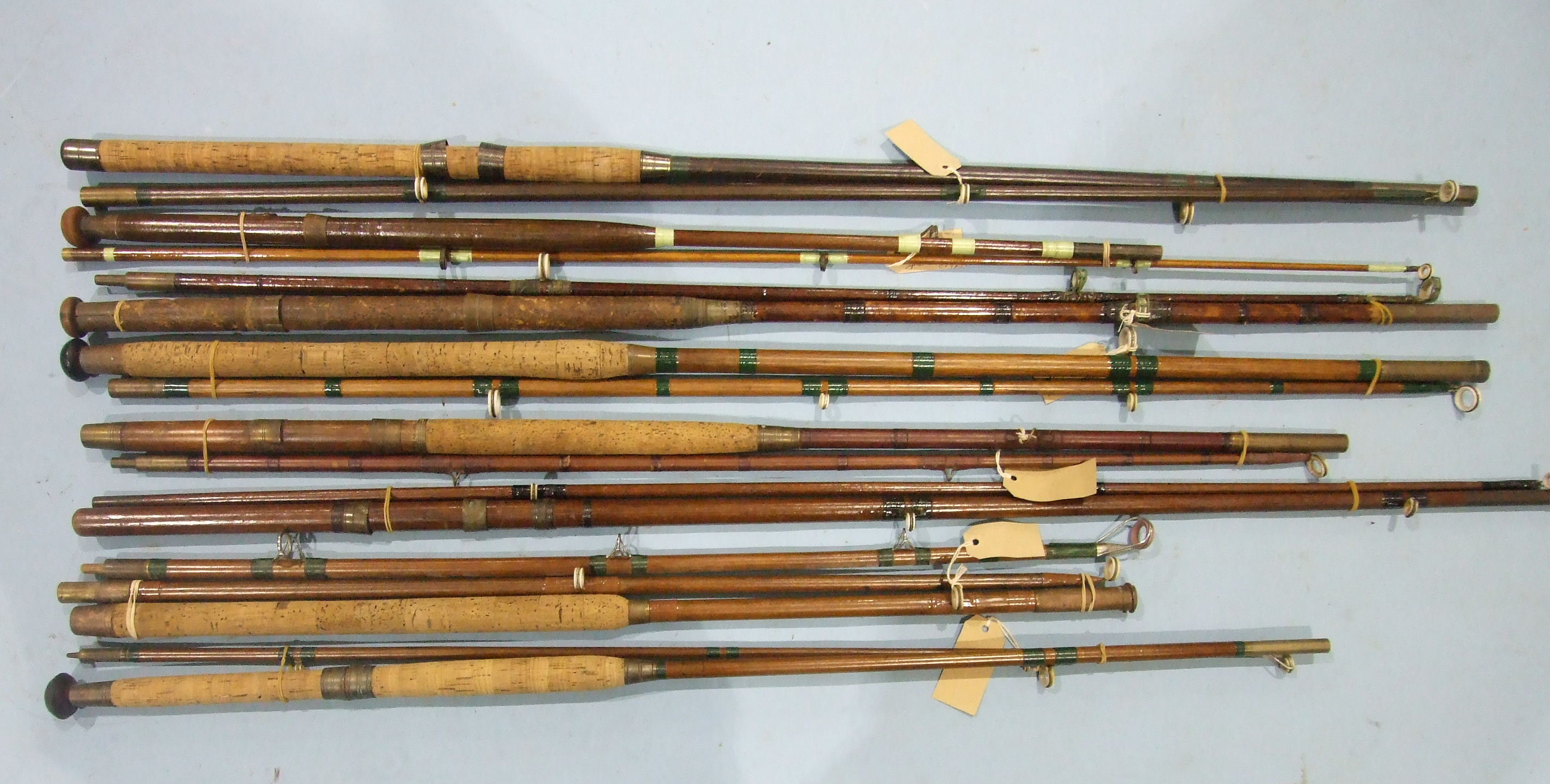 A collection of nine vintage greenheart 7ft and 8ft 2-piece boat rods, with ceramic rings, (9).