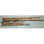 A vintage 9ft 3-piece split-cane spinning rod, with brass rod fittings, re-whipped and other salt