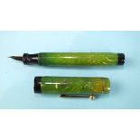 A Wardrite fountain pen with marbled green barrel and cap, the nib stamped 14k, 11cm.