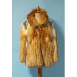 A Red Fox fur jacket, approximately size 12.