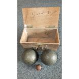 A pair of antique pétanque metal boules with a jack, in box.