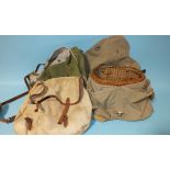 A small wicker creel, 31cm, with canvas strap and cover, two trout bags, two line winders and a