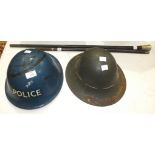 A WWII blue tin helmet with Police livery, another tin helmet, a hardwood walking cane and a Medical