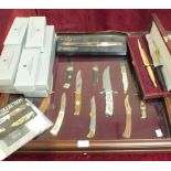 Twelve Franklin Mint 'The Sportsman's Year Hunting and Fishing Knife Collection', in fitted case