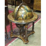 A Globe cocktail cabinet in the form of a terrestrial globe, on stand with hinged lid and fitted