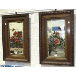 A pair of oak-framed 'gypsy' mirrors with painted floral detail, 83 x 52cm, (2).