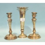 A pair of short loaded silver candlesticks on circular bases, Birmingham 1909 and a plain loaded