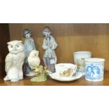 Two Lladro clown figures, one playing a saxophone, the other holding a violin, a Nao owl, (all