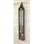 A walnut-cased 'Admiral Fitzroy' barometer, with paper scales and legend, 110cm high, 20cm wide.