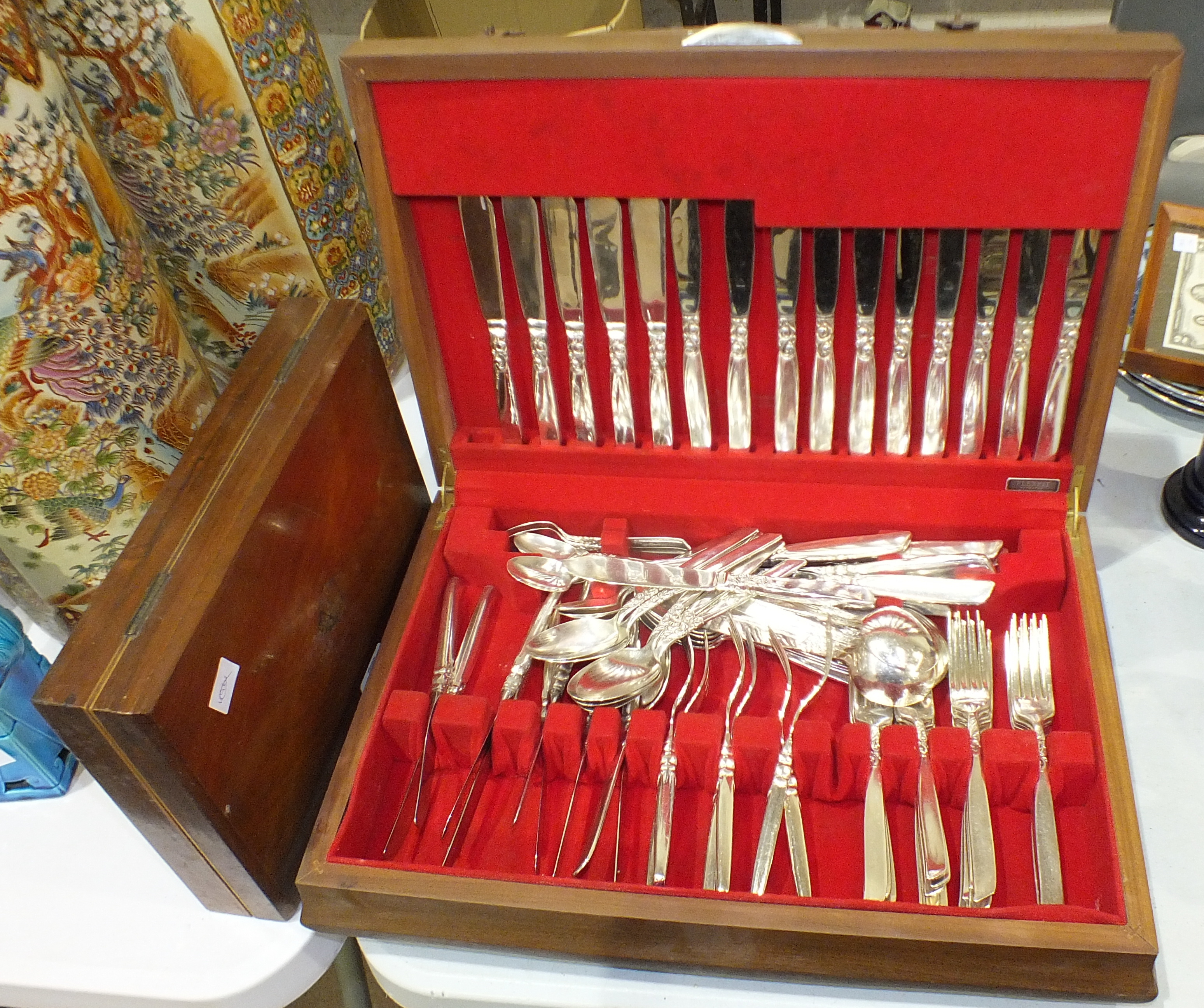 A Flexfit canteen of plated cutlery cased together with six mother-of-pearl-handled forks and five