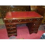 A reproduction mahogany knee-hole desk, 125cm wide.