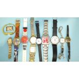 Two Swatch watches and other watches.